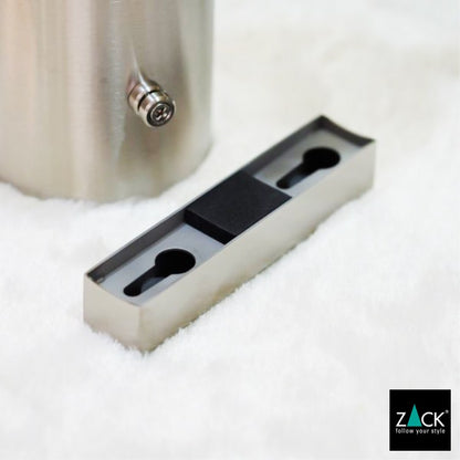 ZACK 40381：銀色の壁付けトイレブラシ：外した取付プレートと容器の裏側